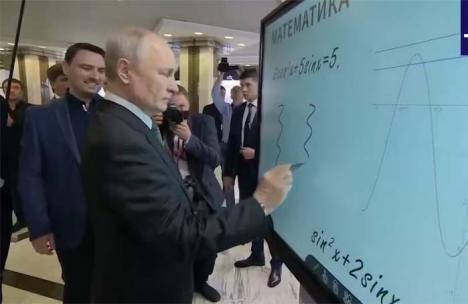 Los textos económicos están en la pared y el profesor Putin sostiene la tiza